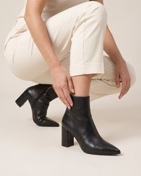 Leather Ankle Boots with Pointed Toe and Block Heel — worn, crouching