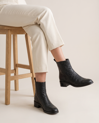 Ankle Boots with Side Pull Tabs and Low Block Heel — worn seated