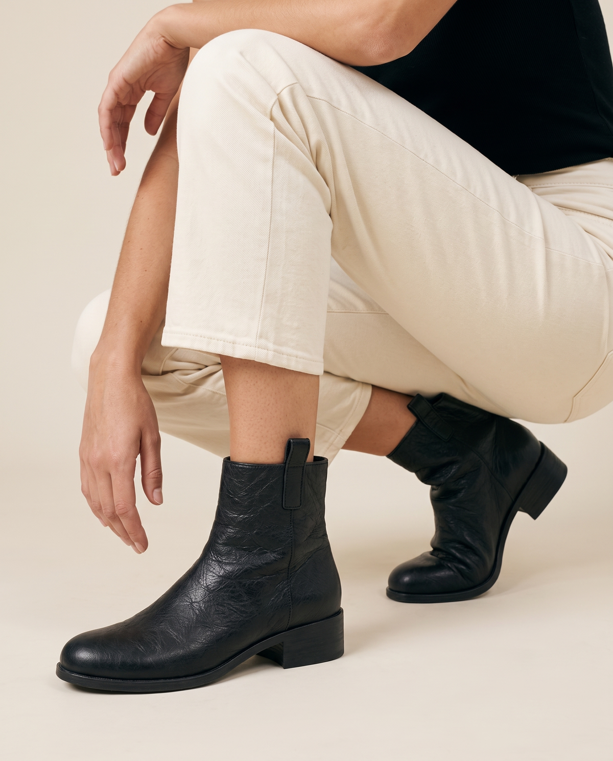 Ankle Boots with Side Pull Tabs and Low Block Heel — worn, crouching