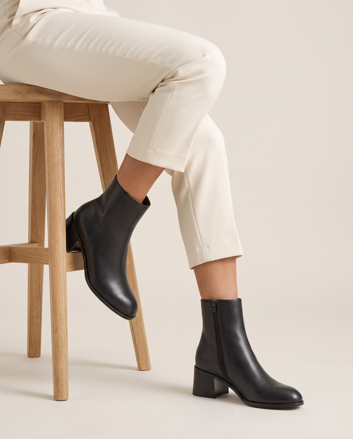 Sleek Ankle Boots with Low Block Heel — worn seated