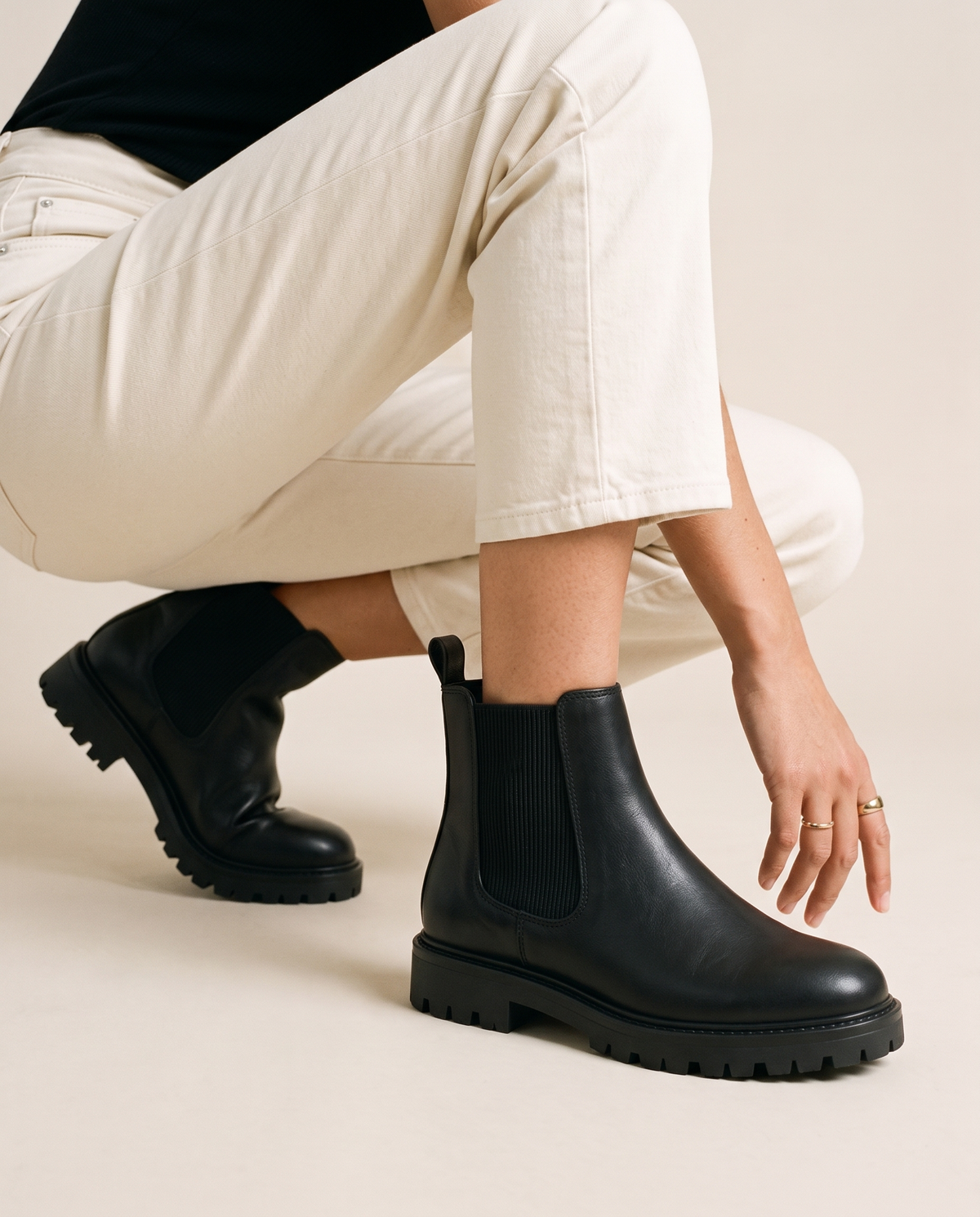 Lug Sole Chelsea Boots with Front and Back Pull Tabs — worn, crouching