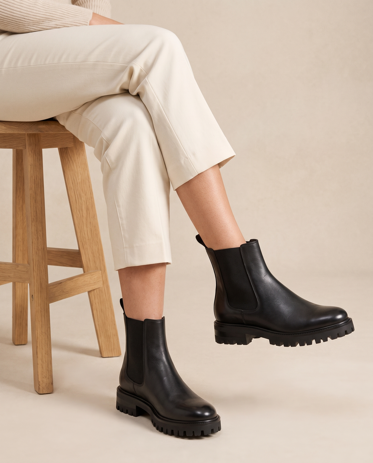 Lug Sole Chelsea Boots with Front and Back Pull Tabs — worn seated