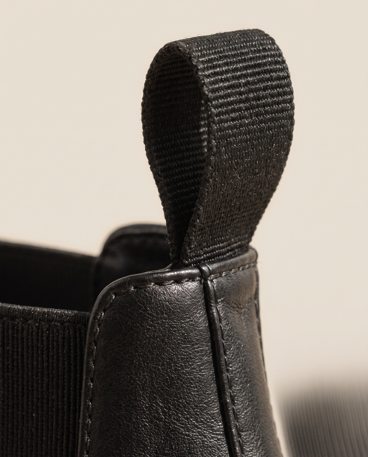 Lug Sole Chelsea Boots with Front and Back Pull Tabs — pull tab close-up