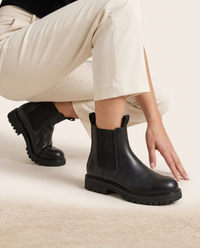 Chelsea Boots with Elastic Panels and Pull Tab — worn, crouching