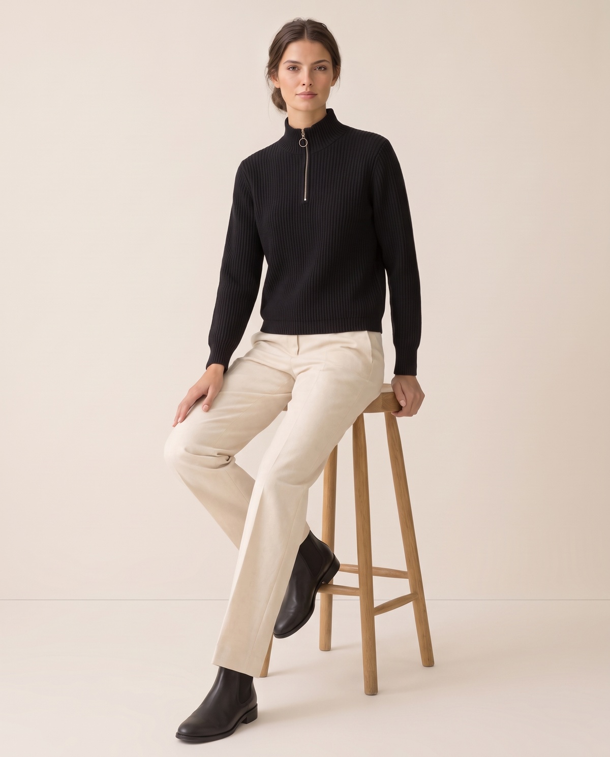 Kestrel Sleek Ribbed Half-Zip Mock Neck Sweater — worn seated