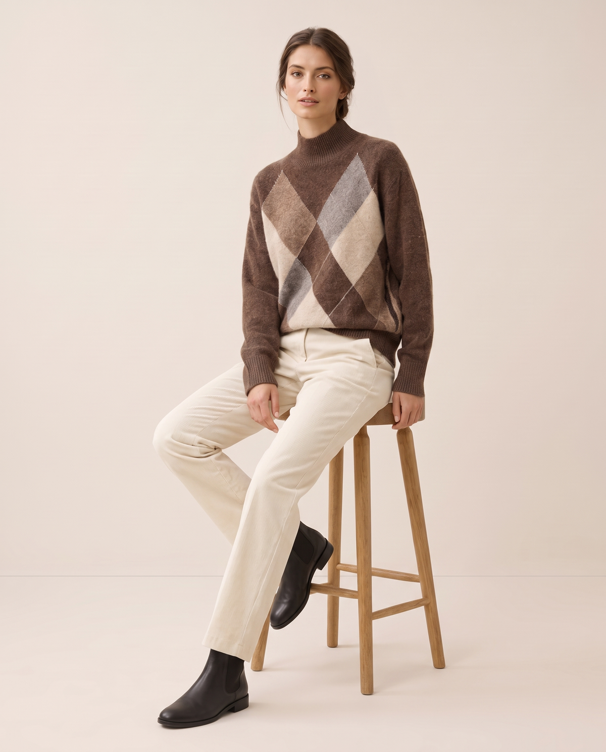 Weymouth Classic High Neck Color Block Argyle Sweater — worn seated