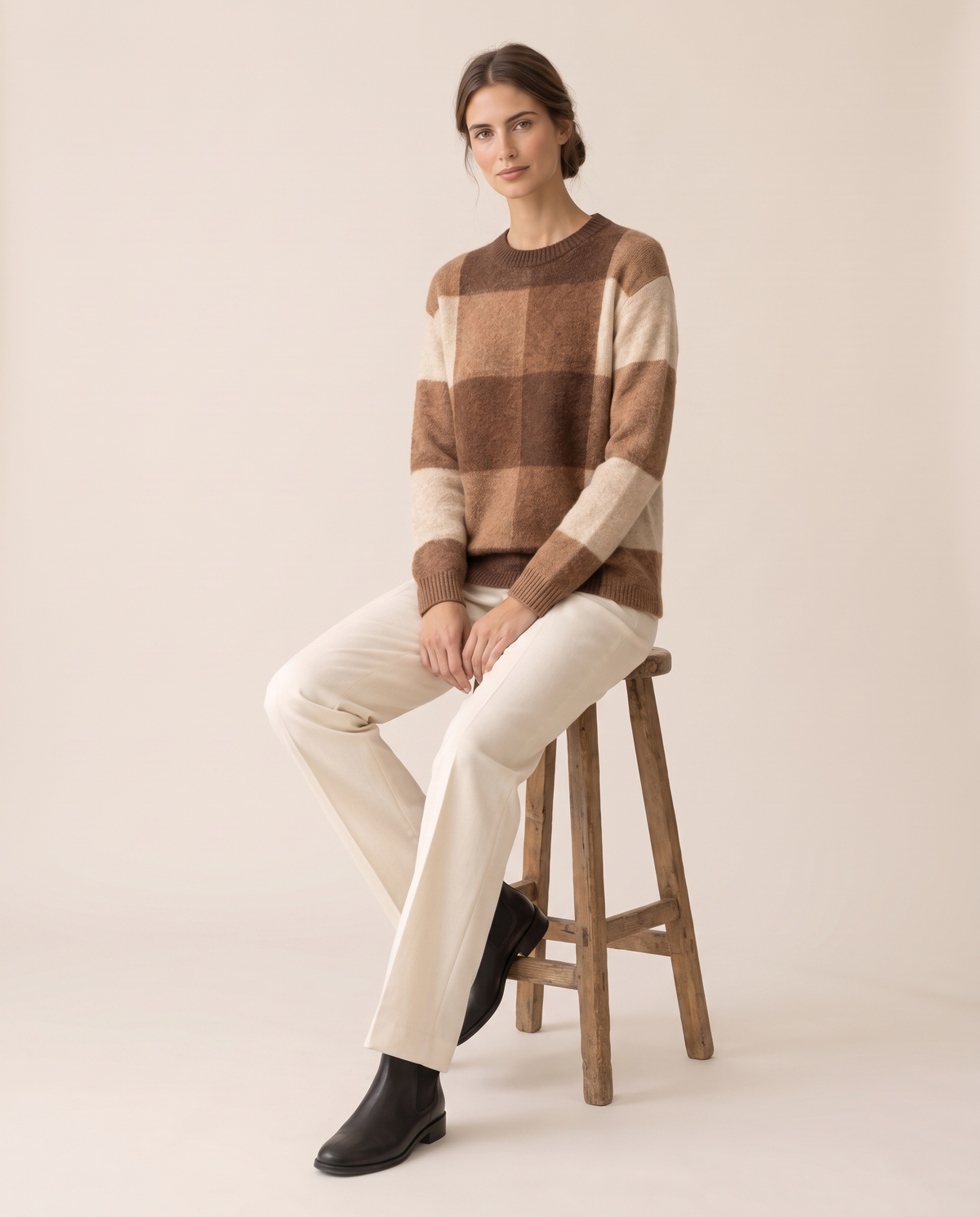 Foxhollow Relaxed Plaid Crew Neck Sweater — worn seated
