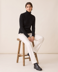 Gloucester Warm Cable Knit Ribbed Turtleneck Sweater — worn seated