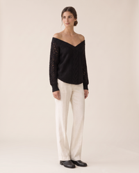 Ischia Relaxed Off-Shoulder Cable Knit V-Neck Sweater — three-quarter view