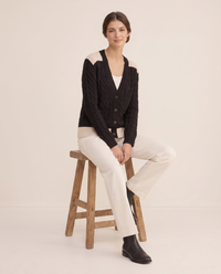 Vietri Relaxed Color-Block Cable Knit Cardigan — worn seated