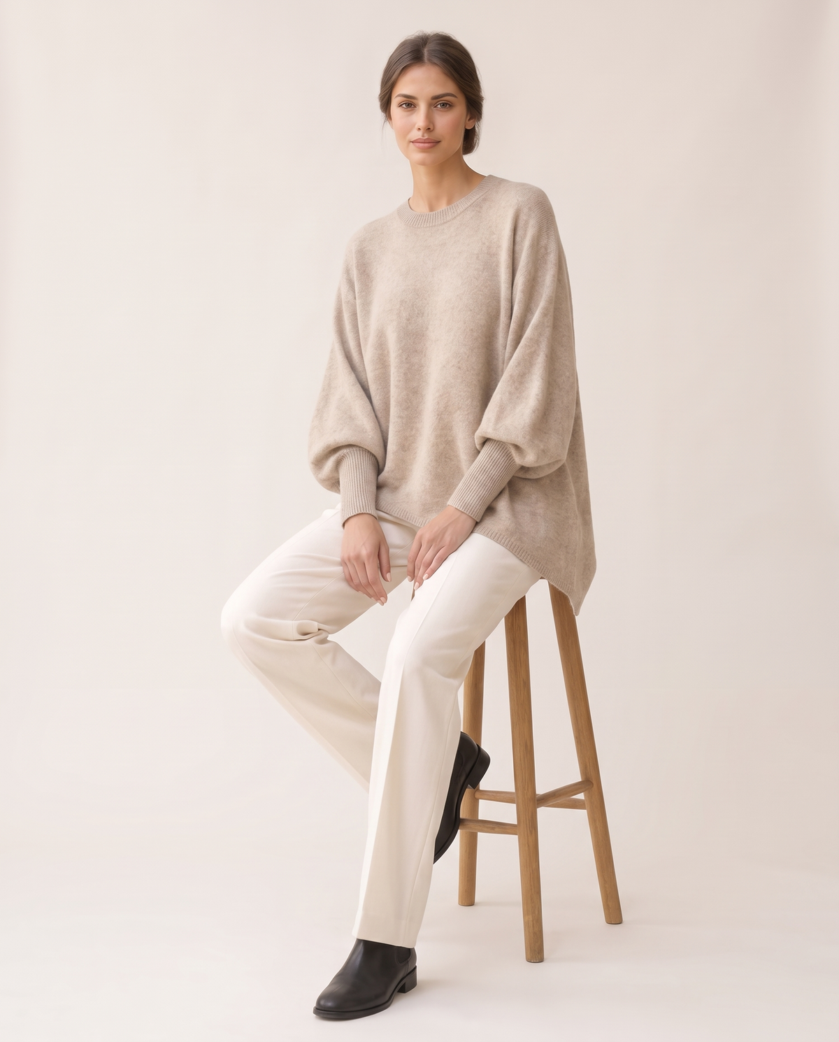 Ghent Warm Wool-Blend Draped Sweater with Asymmetric Hem — worn seated