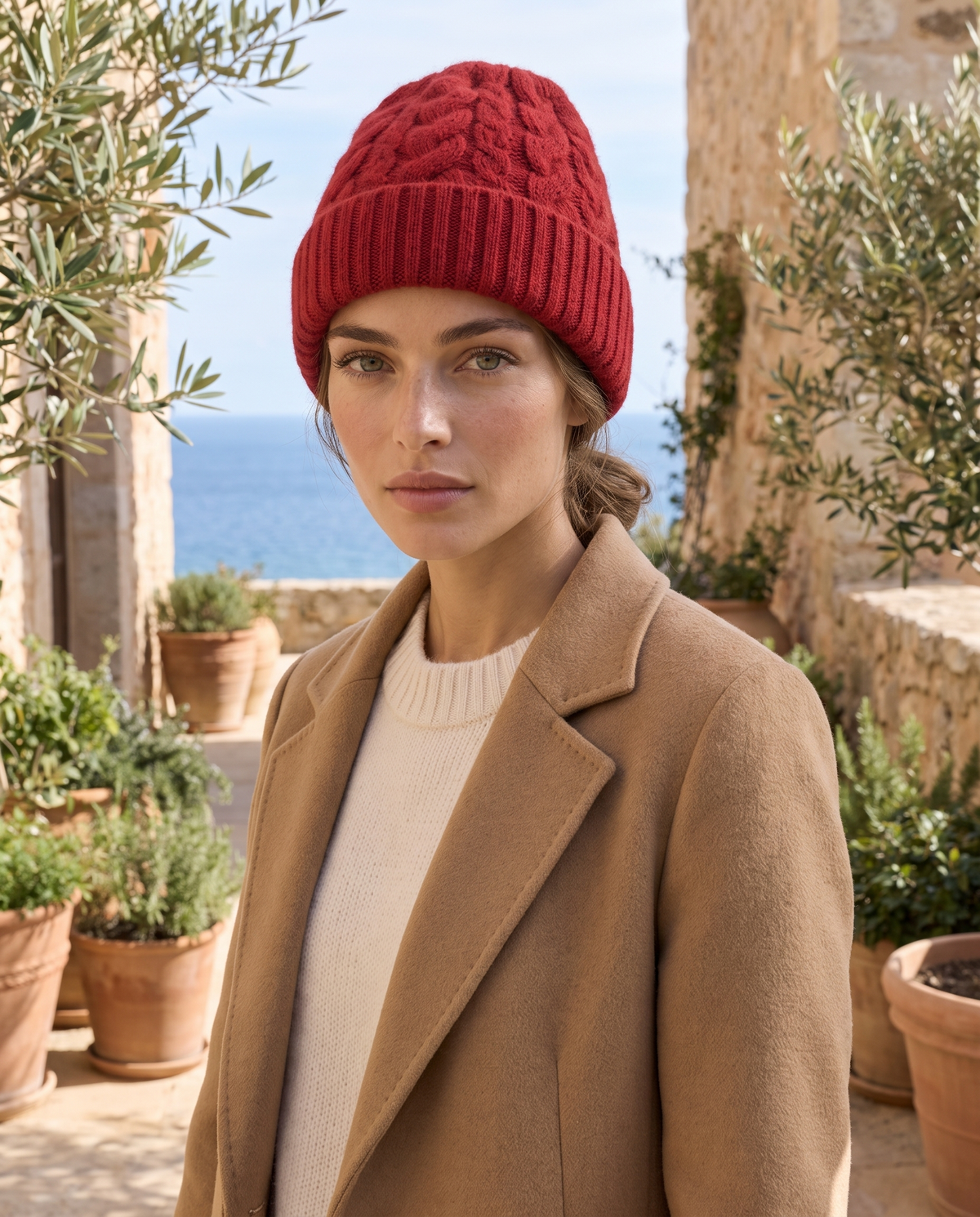 ONORA Hearth Warm Chunky Cable-Knit Ribbed Beanie — worn on a villa terrace