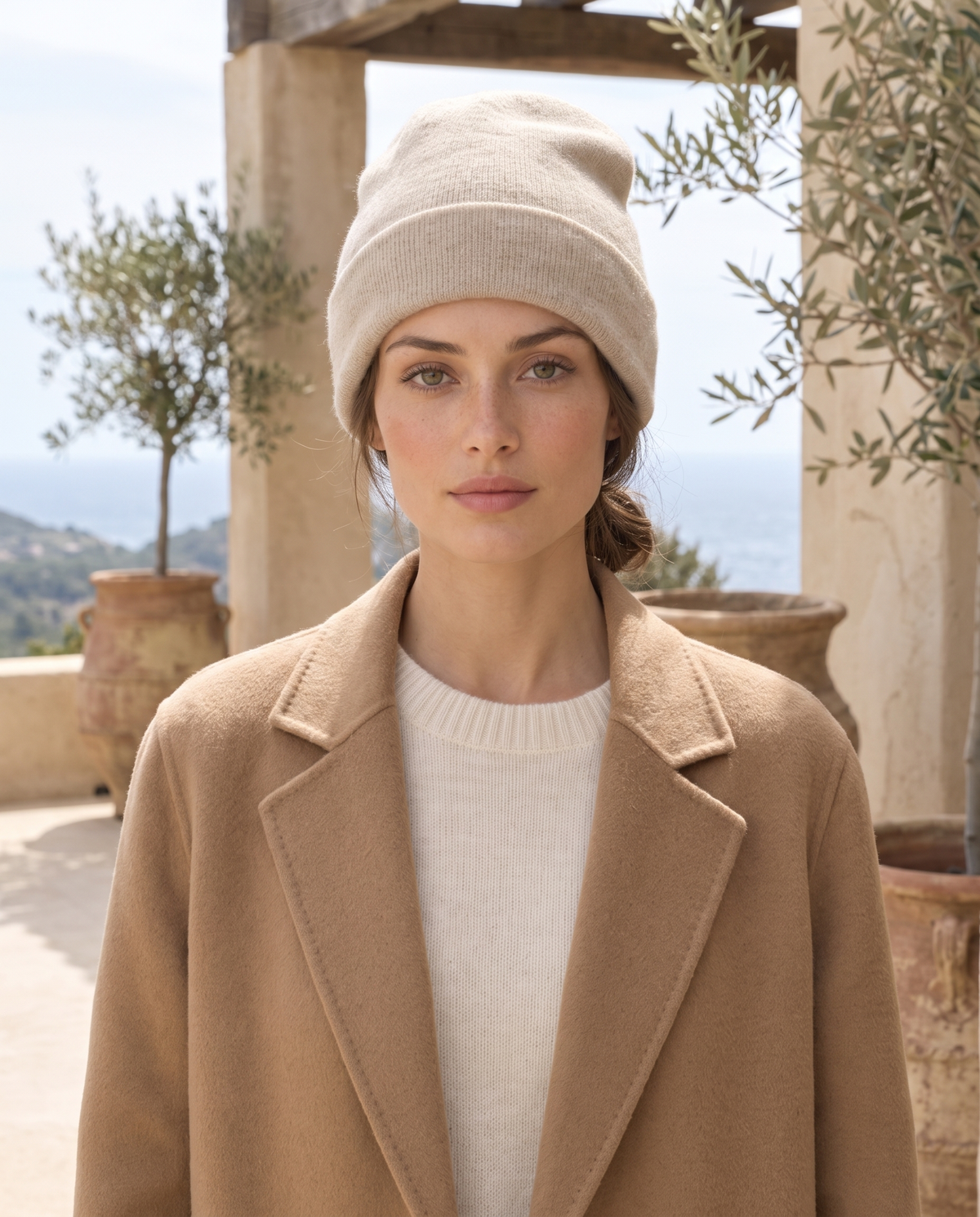 ONORA Pinecrest Relaxed Classic Cashmere Knit Beanie — worn on a villa terrace