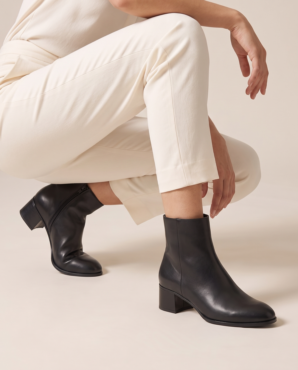 Sleek Ankle Boots with Low Block Heel — worn, crouching
