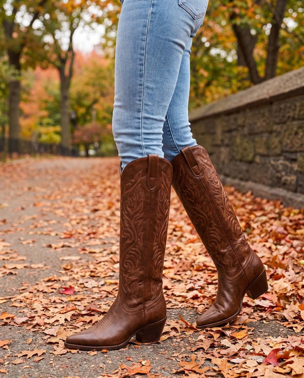 Knee-High Western Boots with Floral Embroidery — worn with jeans in Central Park