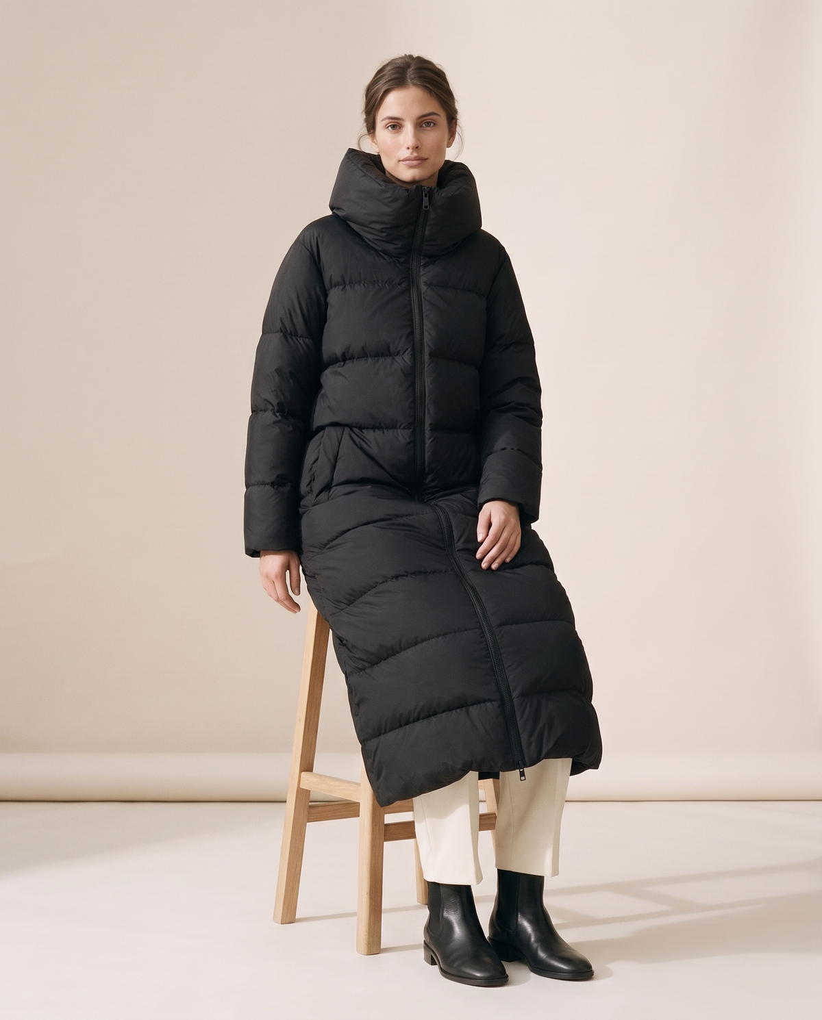 Long Puffer Coat with Oversized Collar — worn seated