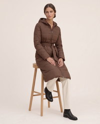 Long Belted Hooded Winter Coat — worn seated
