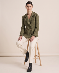 Floral Embroidered Utility Jacket with Ruffle Trim — worn seated