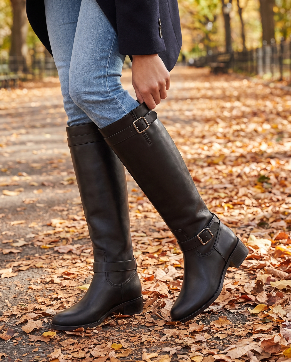 Knee-High Riding Boots with Buckle Straps and Low Block Heel — worn with jeans in Central Park