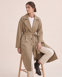 Long Tie-Waist Trench Coat for Women — worn seated