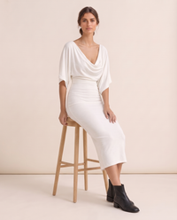 Harrow Sleek Batwing Sleeve Knit Midi Dress — worn seated