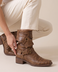 Distressed Ankle Boots with Buckle Straps — worn, crouching