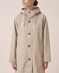 Oversized Hooded Raincoat for Women — button front and pockets, worn