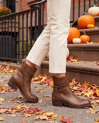 Lace-Up Western Ankle Boots with Studded Trim — worn on a New York street in autumn