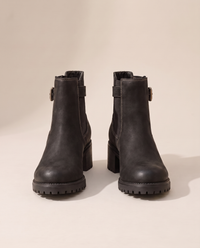 Chelsea Ankle Boots with Buckle Strap and Lug Sole — pair, studio