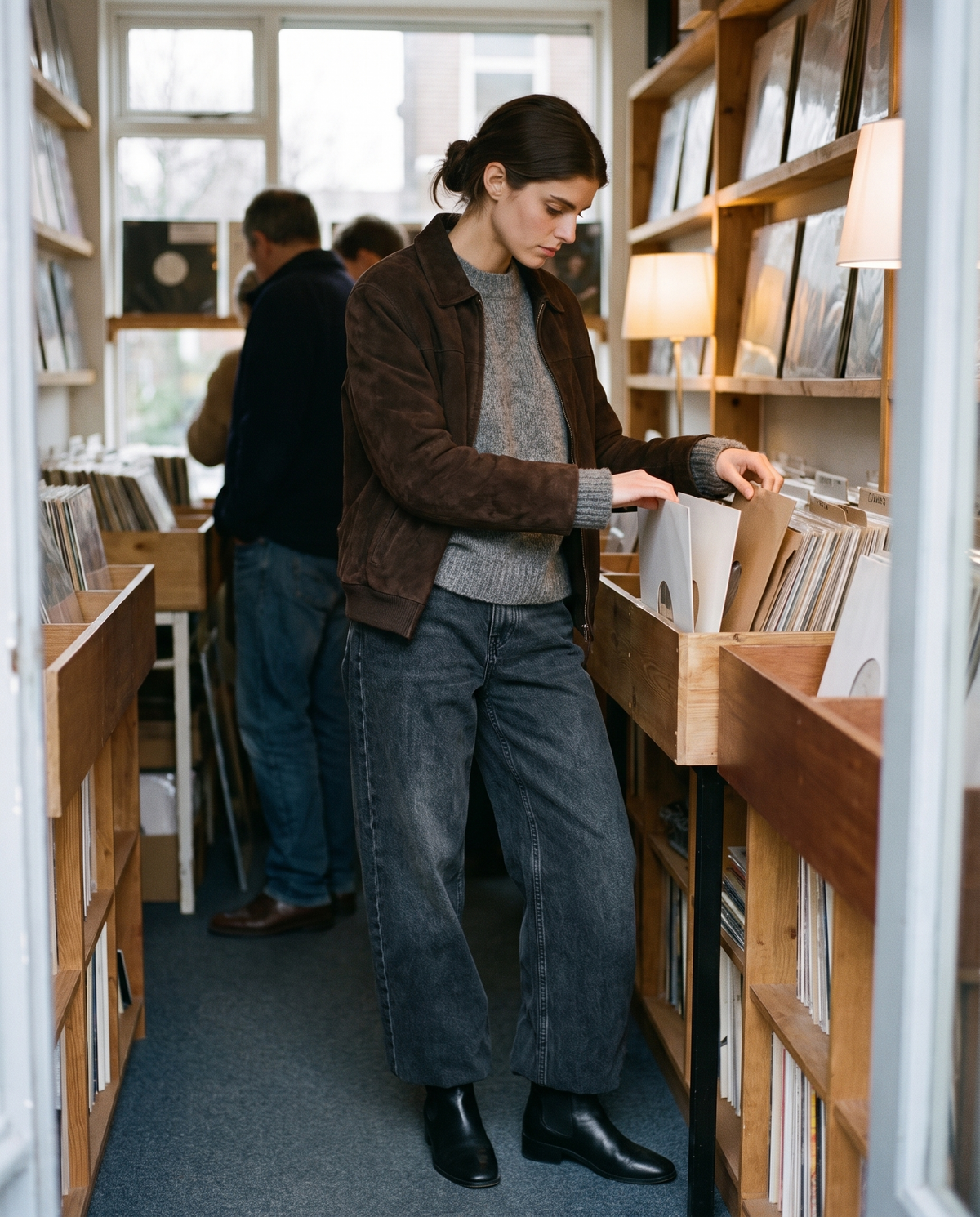 Kristin Baggy Jeans in black wash, browsing a vinyl record shop