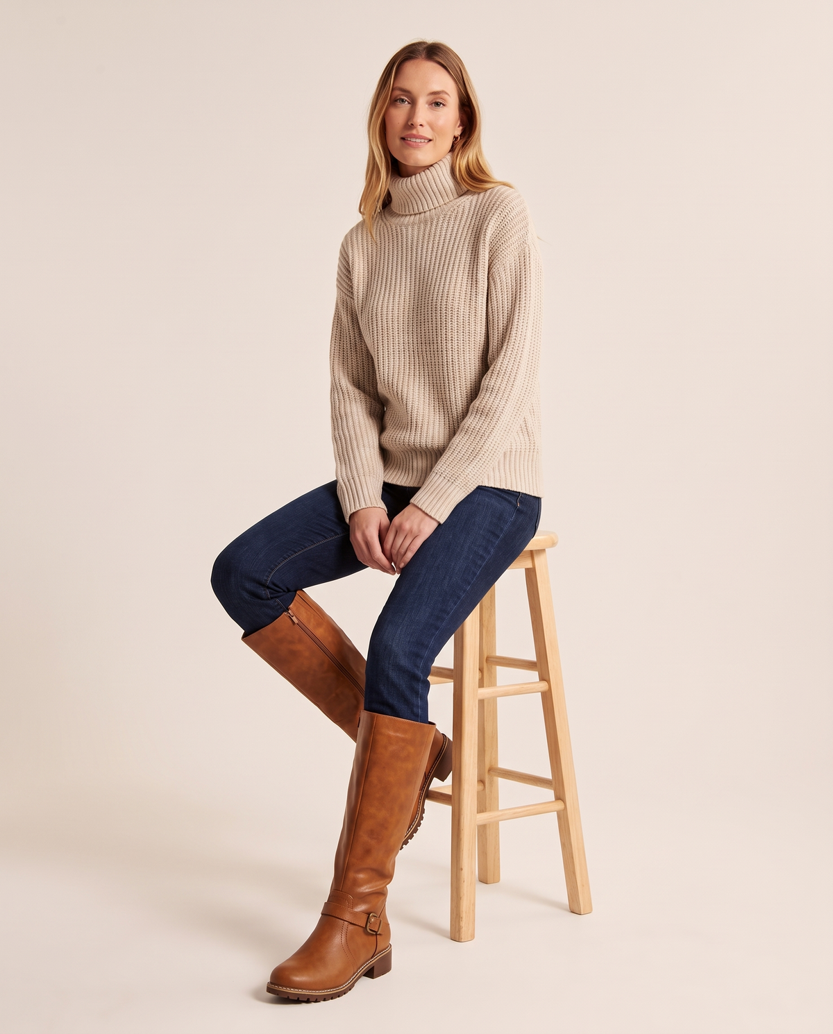 Knee-High Riding Boots with Buckle Strap for Women — worn seated
