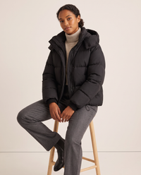 Oversized Hooded Puffer Jacket for Women — worn seated