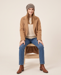 Fleece-Lined Knit Beanie for Women — worn seated