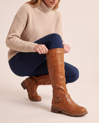 Knee-High Riding Boots with Buckle Strap for Women — pulling on the boot