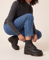 Chunky Platform Leather Ankle Boots with Front Zip — pulling on the boot