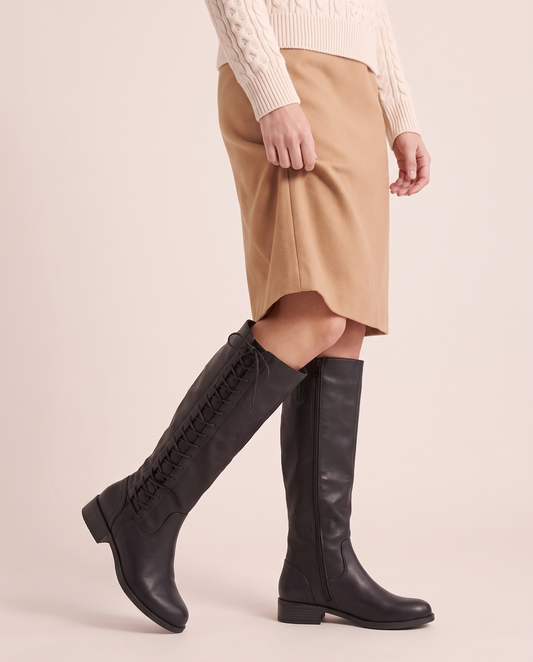 Lace-Up Knee-High Boots with Low Block Heel for Women — worn mid-step, outer lace-up side