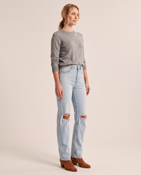 Light blue ripped straight jeans, three-quarter view