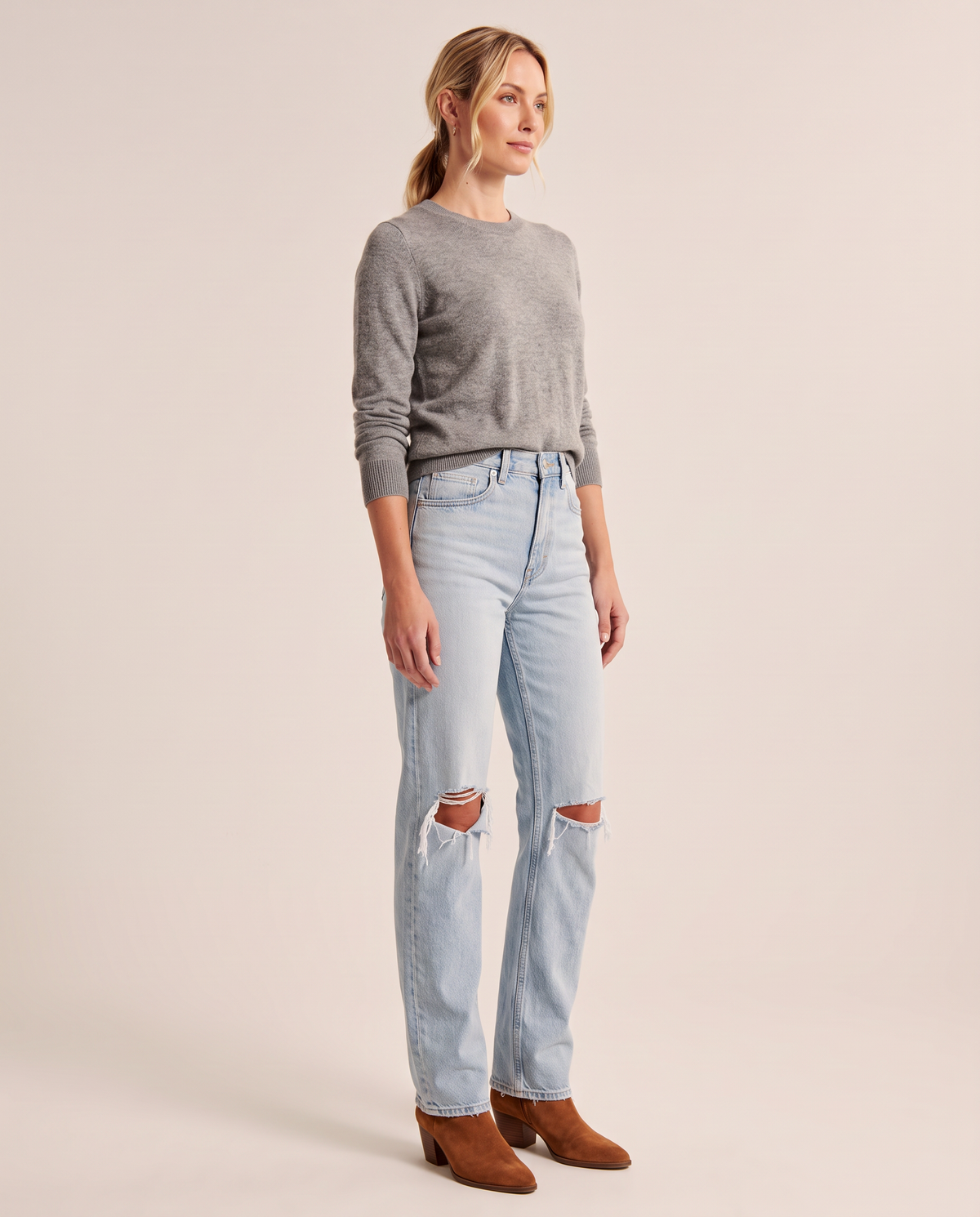 Light blue ripped straight jeans, three-quarter view