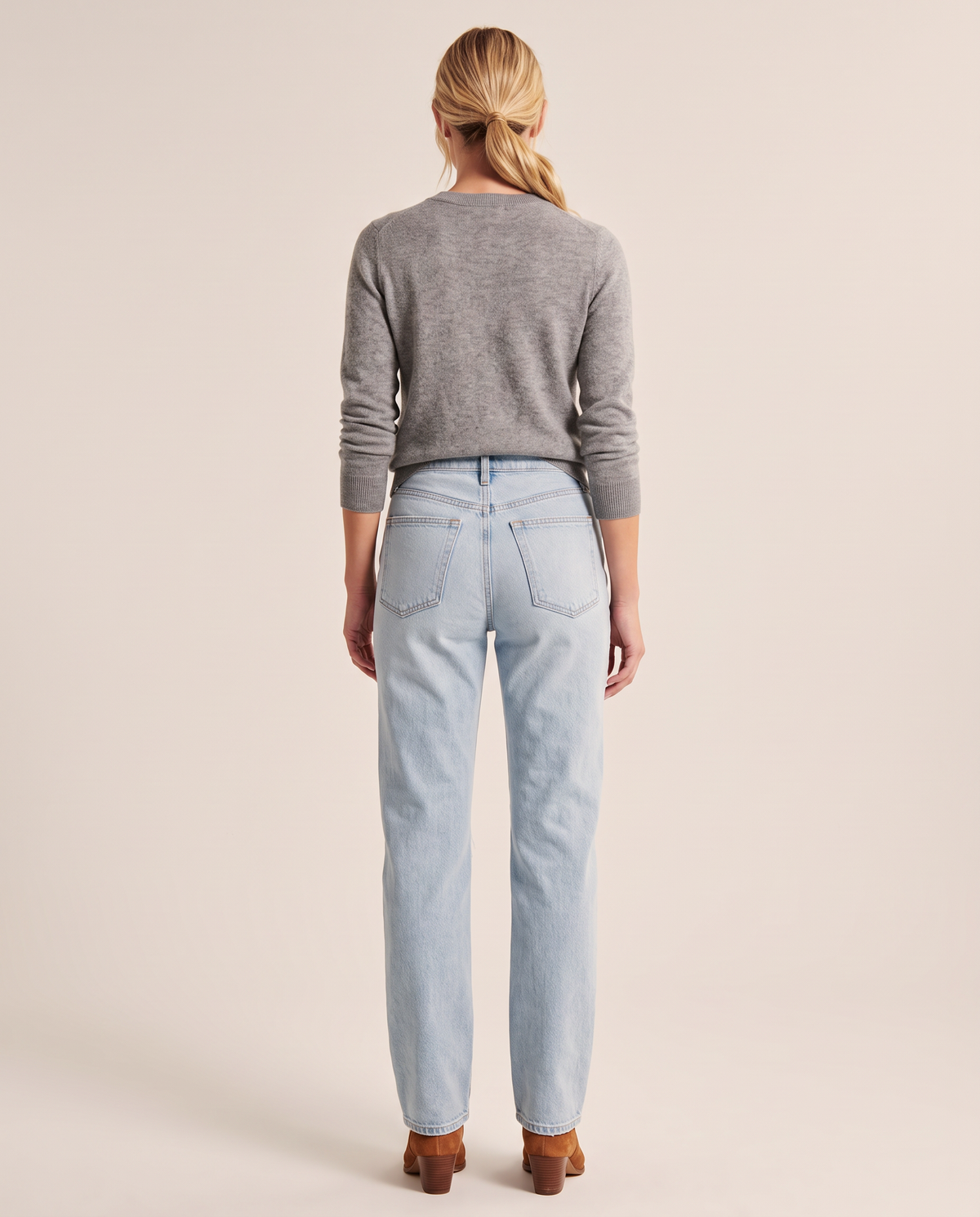 Light blue straight jeans, studio back view