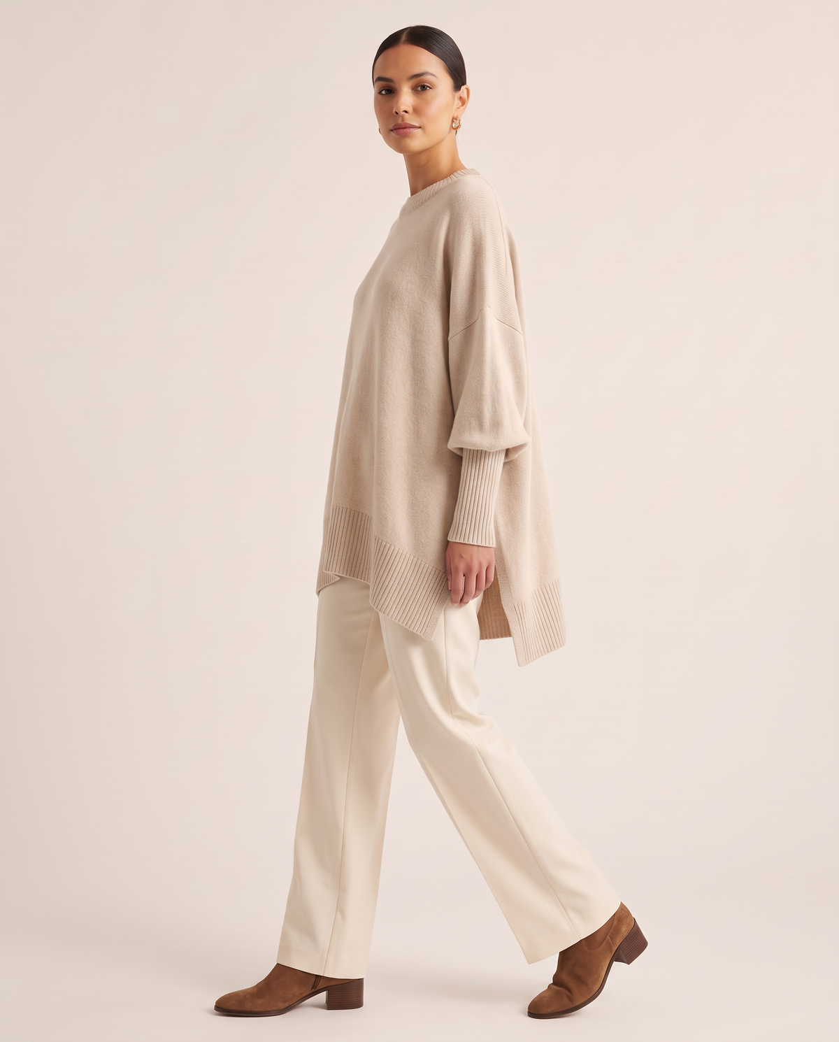 Women's Oversized Crew Neck Knit Sweater — side view, asymmetric hem