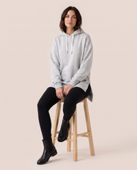 Oversized Hoodie Dress — worn seated