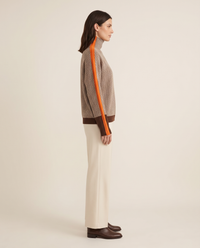 Striped Herringbone Turtleneck Sweater — side profile showing the sleeve stripe