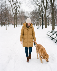 Women's Long Winter Coat with Faux Fur Lined Hood — yellow, walking a dog in a snowy park