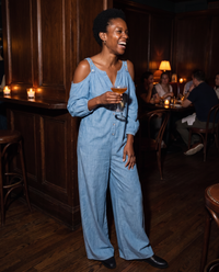 Ashland Relaxed Cold-Shoulder Wide-Leg Jumpsuit — at a candlelit cocktail bar