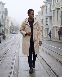 Oversized Hooded Raincoat for Women — walking up a foggy San Francisco street