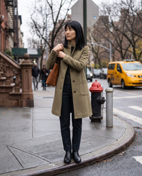 Women's Stand-Collar Coat with Deep Pockets — waiting to cross a Manhattan street on a cloudy afternoon