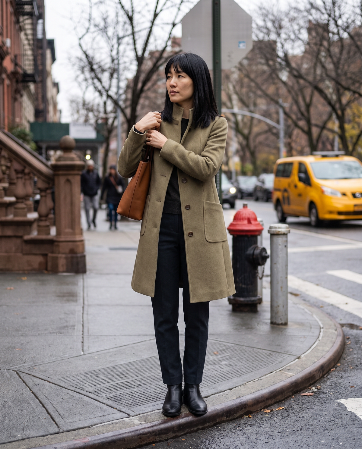 Women's Stand-Collar Coat with Deep Pockets — waiting to cross a Manhattan street on a cloudy afternoon