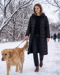 Longline Hooded Puffer Coat with Welt Pockets — walking a dog in a snowy park