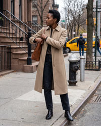 Slim-Fit Longline Coat for Women — waiting to cross a Manhattan street on a cloudy afternoon