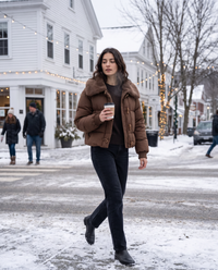Cropped Puffer Jacket with Plush Collar — crossing a snowy Vermont village street